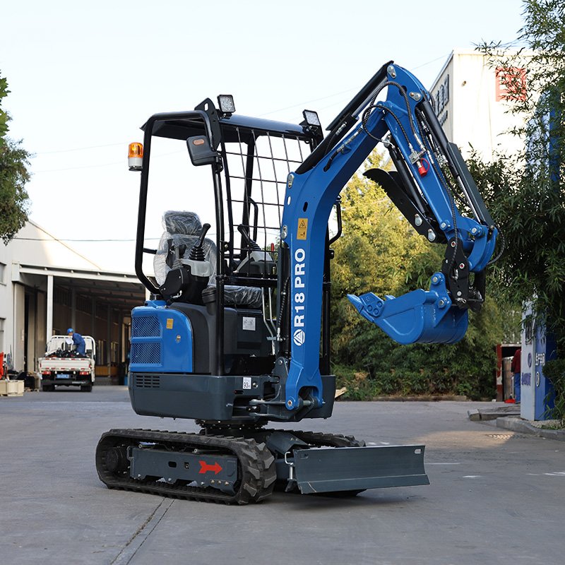 Rippa R18 Pro mini excavator with canopy and blade on gravel