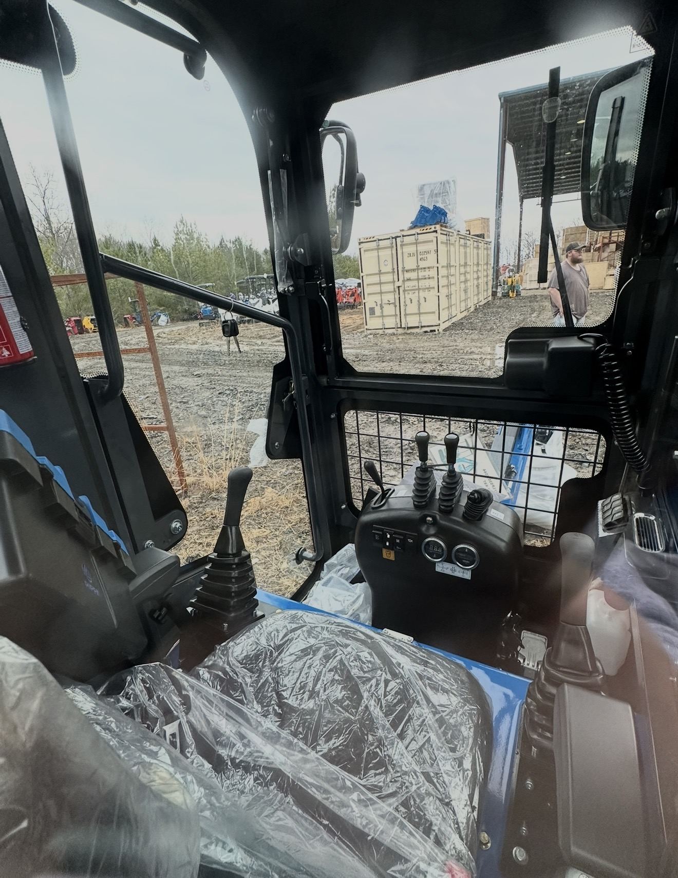 Rippa RS06 Pro mini skid steer at sunset in front of the Blue Ridge